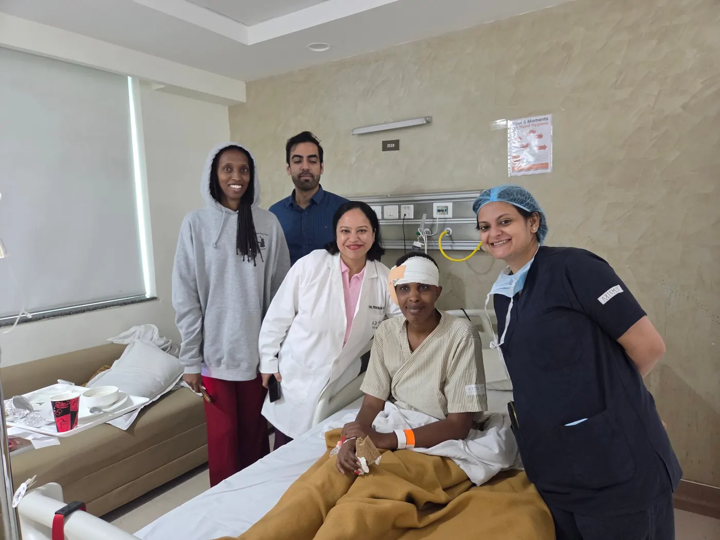 Dr. Trisha Srivastava and the ENT team with a patient and her family